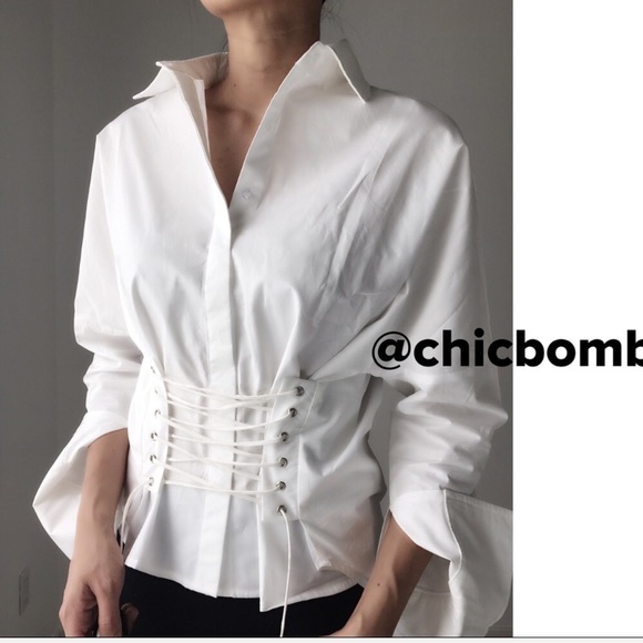 CHICBOMB Tops - Thoeri modern lace up shirt.